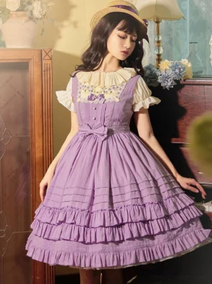 Purple sweet Lolita jumper dress front view with tiered ruffled skirt, chest embroidery, and bow waist decoration, worn with straw hat in vintage piano room setting