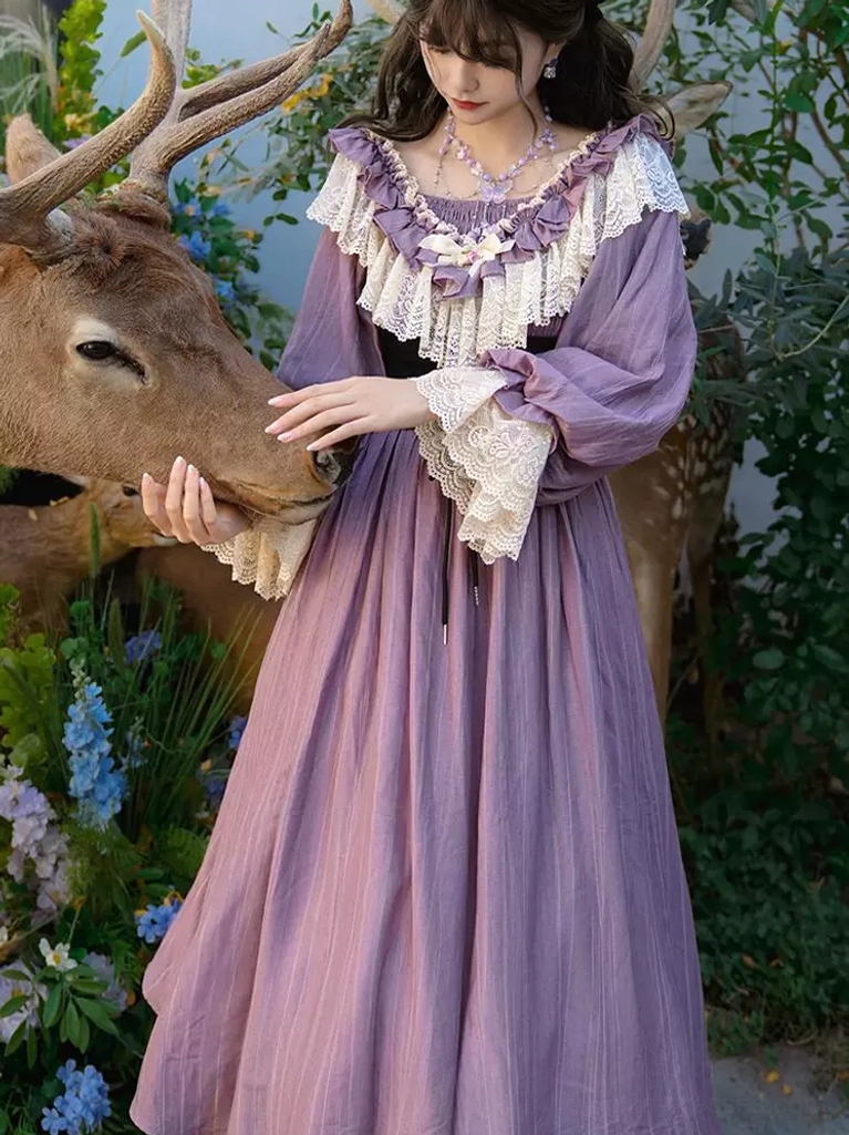 Purple Victorian classic lolita dress front three-quarter view featuring lace ruffled collar and lantern sleeves outdoor garden setting
