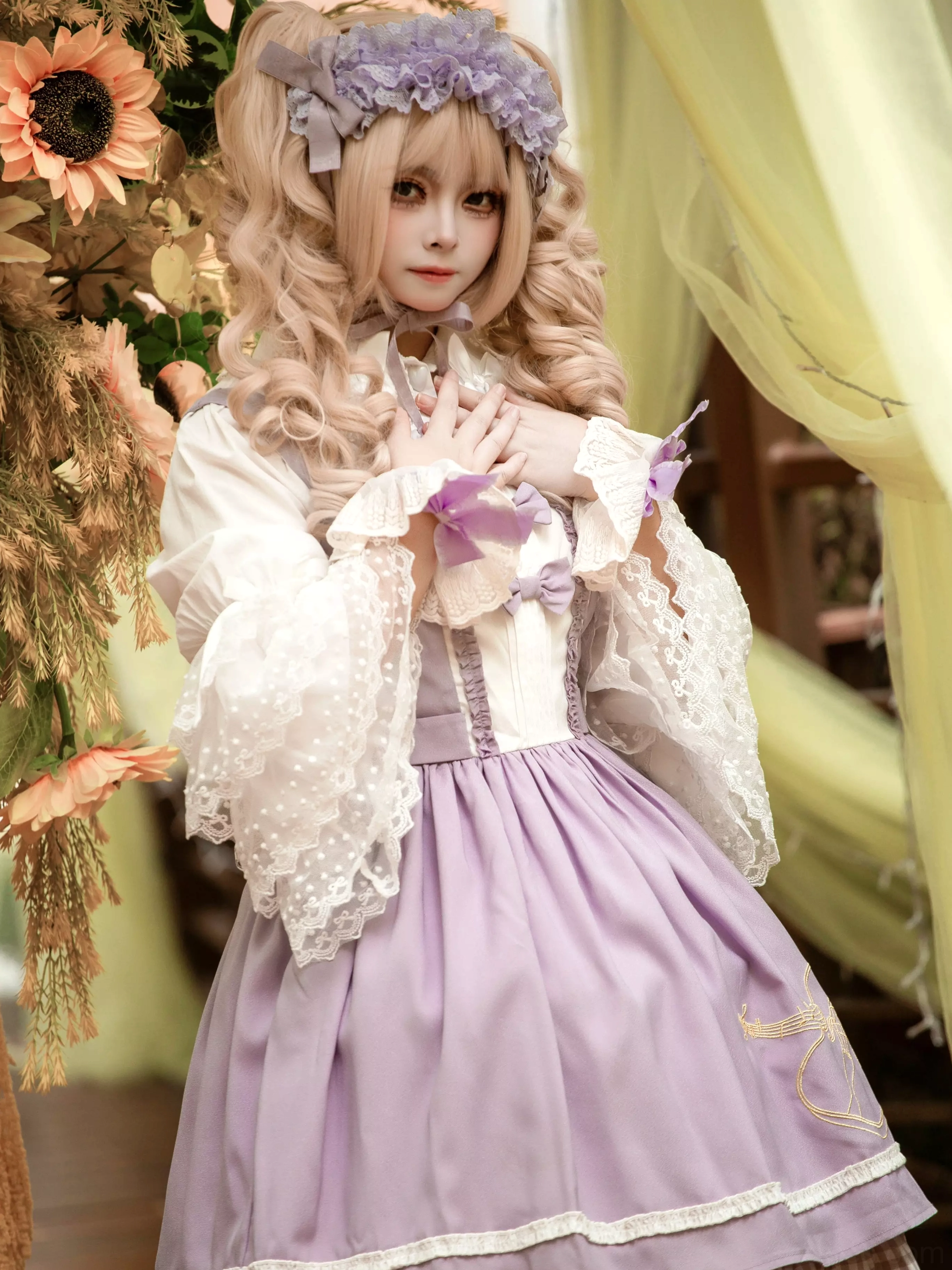 Purple violin lolita dress front medium view with lace cuffs purple hair accessory and golden violin embroidery detail