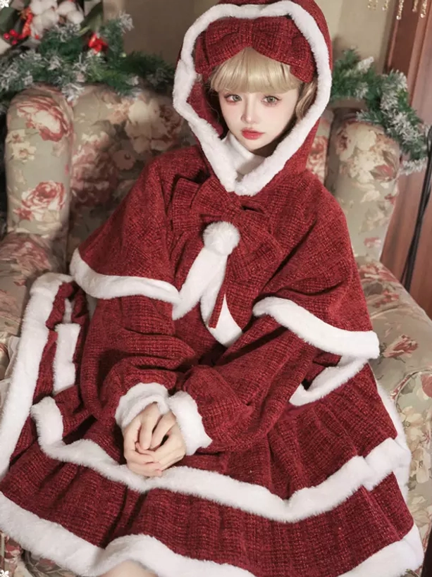 Front full shot of red Christmas lolita hooded cape dress set on floral vintage sofa with coordinating head bow and complete ensemble display