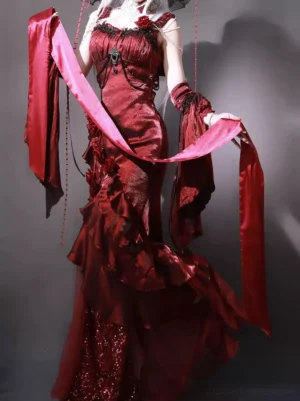 Red gothic lolita dress rear three-quarter angle showing sequined skirt hem, chest brooch details, and dramatic ruffled train silhouette