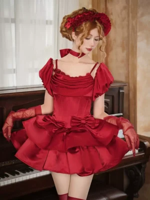 Red Gothic Lolita mini dress with ruffled bow skirt, off-shoulder puff sleeves, satin fabric, shown on model in vintage piano studio setting with red gloves and choker