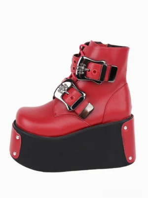 Single red Gothic platform boot detailed view featuring thick black platform sole, skull-shaped silver buckles, and rich crimson PU leather construction, right angle perspective