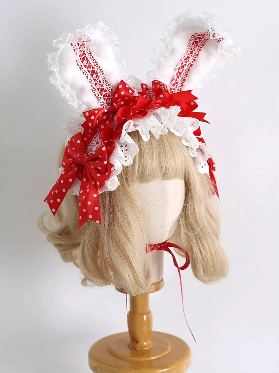 Red lace bunny ear lolita headdress with polka-dot bows and white ruffled trim front view on blonde mannequin