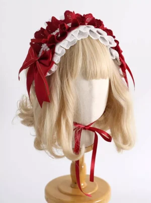Red Lolita hair accessory headband with white eyelet lace trim and red satin bows, front central view on blonde bob wig mannequin, featuring adjustable ribbon neck fastening for secure fit