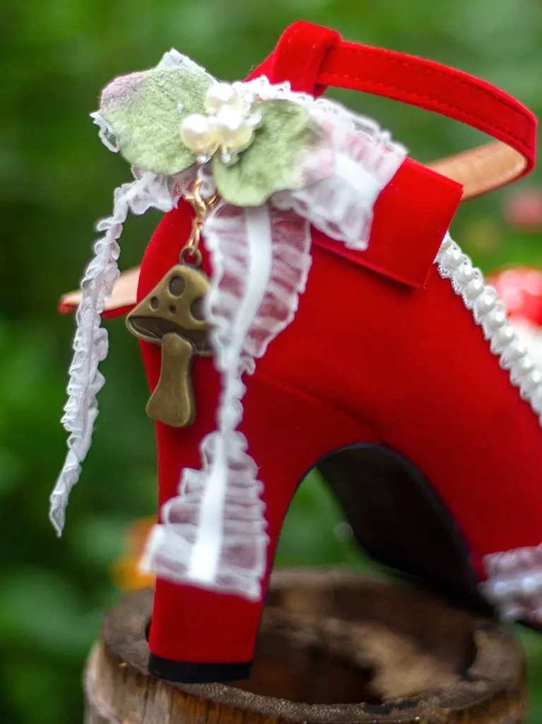 single red lolita block heel shoe rear side view wooden surface ankle strap lace ruffle metal mushroom charm green leaf decor