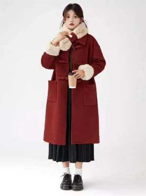 Red lolita wool overcoat full front view with faux fur trim, front patch pockets, model holding takeaway coffee cup casual styling