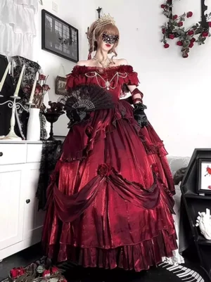 Red off-shoulder Gothic Lolita ball gown with layered ruffled skirt front full-body view worn with crown and masquerade mask