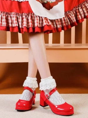 Red patent leather Mary Jane chunky heel Lolita pumps with round toe and adjustable ankle strap buckle, front low view on model wearing red gingham Lolita dress with white frilly ankle socks