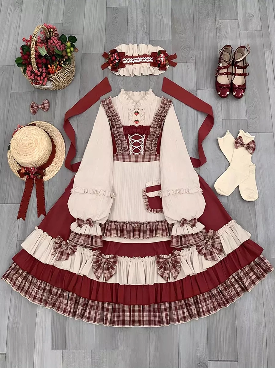 Red plaid sweet Lolita dress with removable components showing apron cap and pieces for modular styling versatility