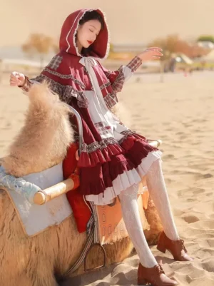 Little Red Riding Hood themed classic lolita dress - front three-quarter view - hooded cape with checkered sleeve cuffs and lace trim - burgundy and cream layered ruffled skirt design
