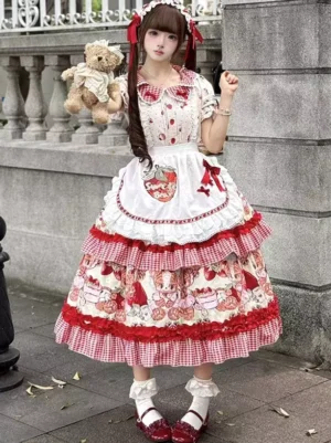 Red strawberry sweet lolita dress with tiered ruffles and gingham apron, short sleeves, full front view outdoor