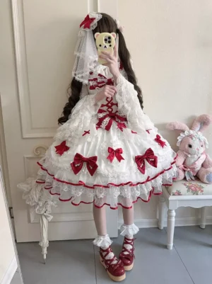 Red sweet lolita bridal dress full body front view on model wearing wedding veil and red shoes with plush rabbit decor