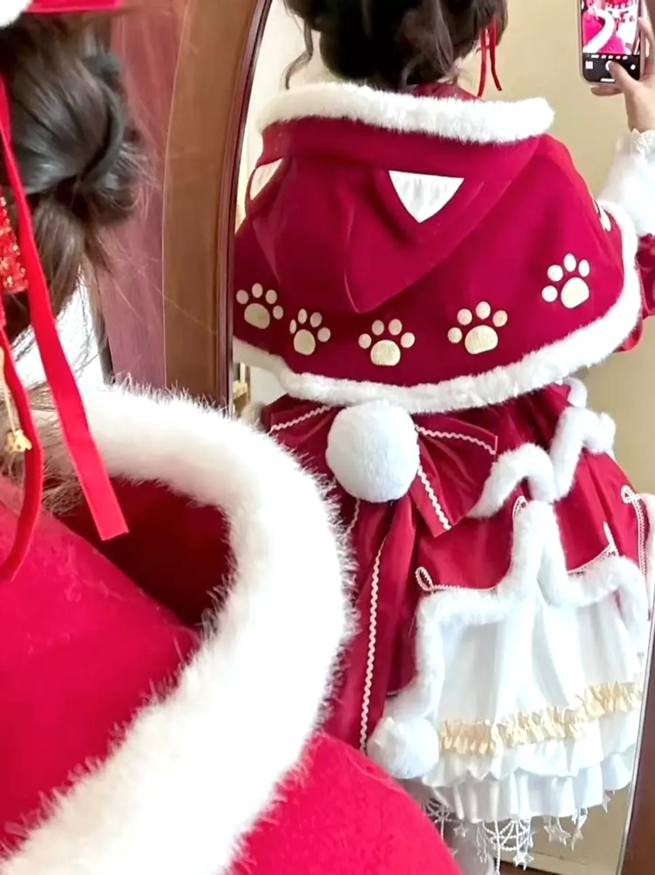 Back mirror selfie view of Sweet Lolita Christmas cat paw set showing cat ear-shaped hood details, pom-pom tail decoration, white fur trim, and embroidered cat paw print patterns
