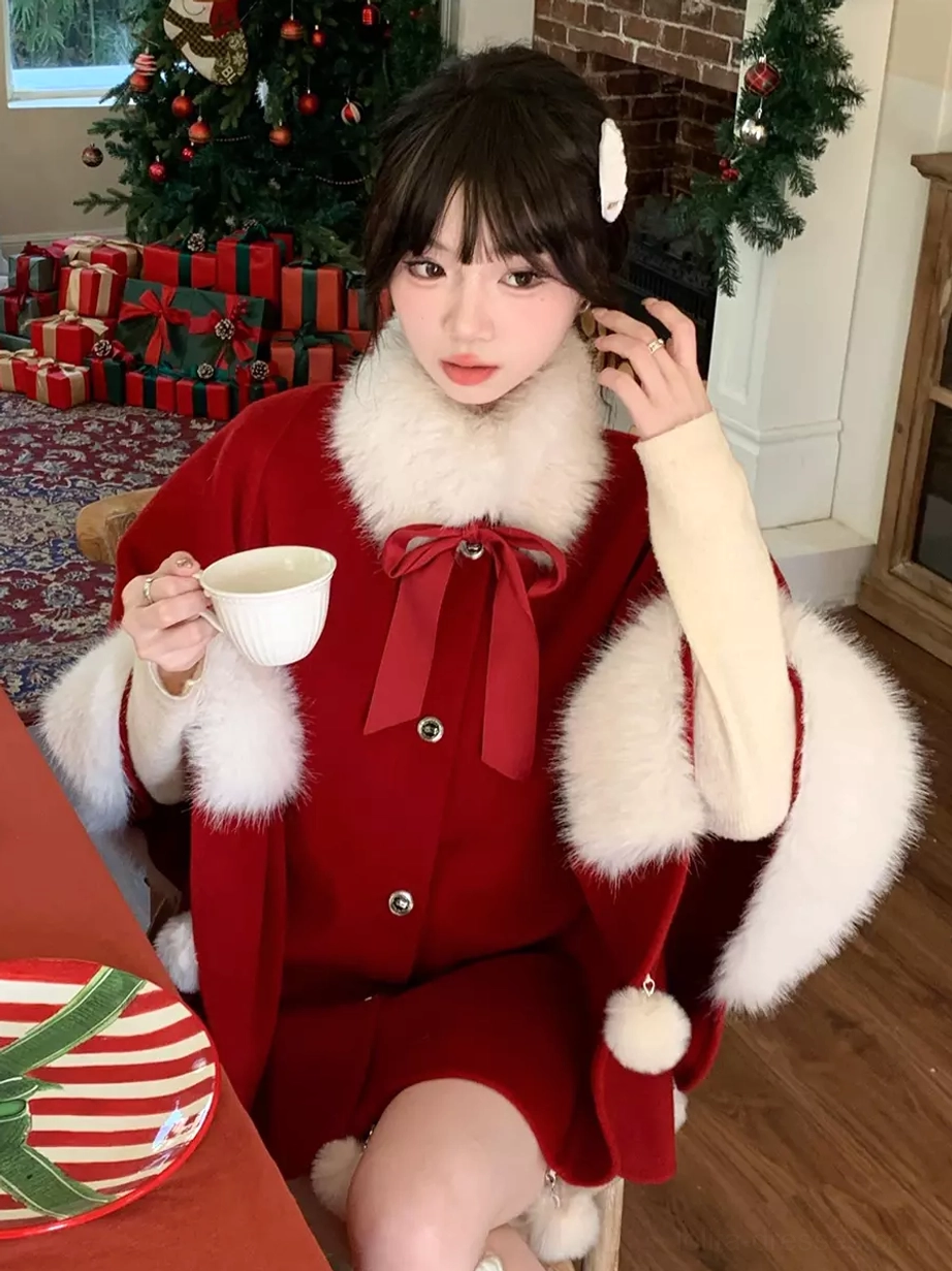 Red Sweet Lolita Christmas cape coat close-up front detail view model holding white teacup red neck bow fuzzy sleeve trim sitting at Christmas dining table