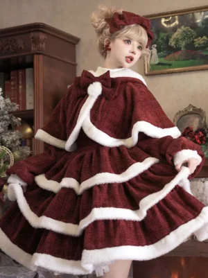 Red sweet lolita Christmas dress cape set three-quarter front view showing tiered ruffles white fuzzy trims and matching head bow in vintage Christmas room setting