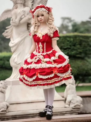 Red sweet Lolita dress back view displaying layered ruffled skirt with white lace trim edges, fitted waist, and model in white stockings and platform shoes