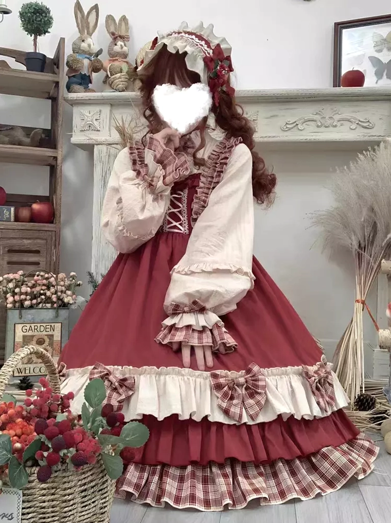 Red sweet Lolita dress ensemble back view showing cape drape construction and apron detailing from rear perspective