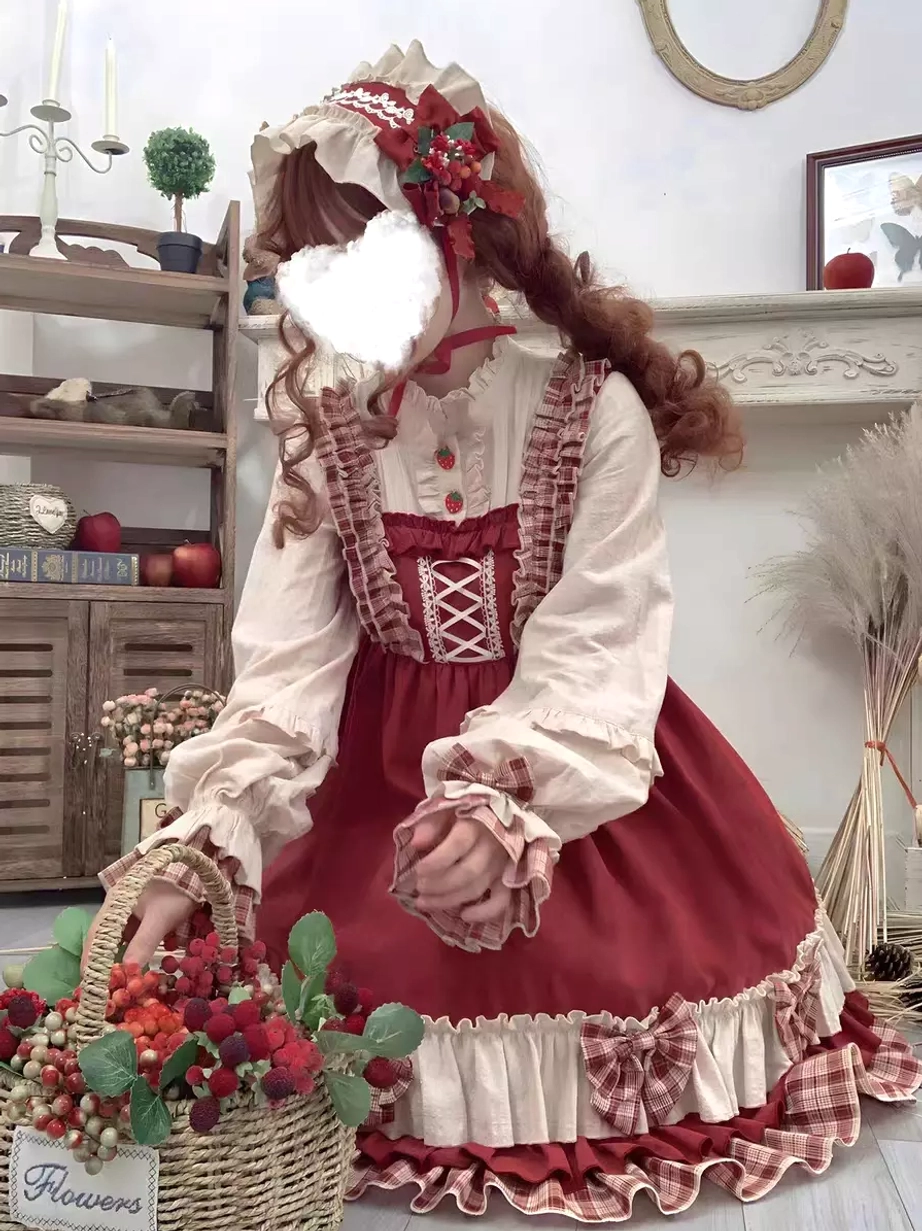 Side profile view of red sweet Lolita dress with inner blouse and floral curly hair decoration showing ruffled hem silhouette