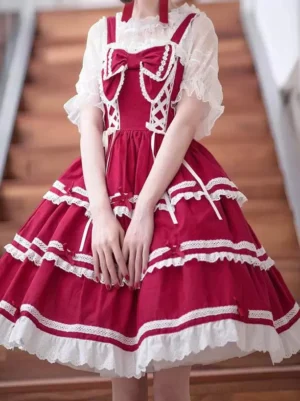Red sweet lolita dress set styled on model with white blouse lace outer layer front bow layered ruffled skirt indoor wooden stairs background