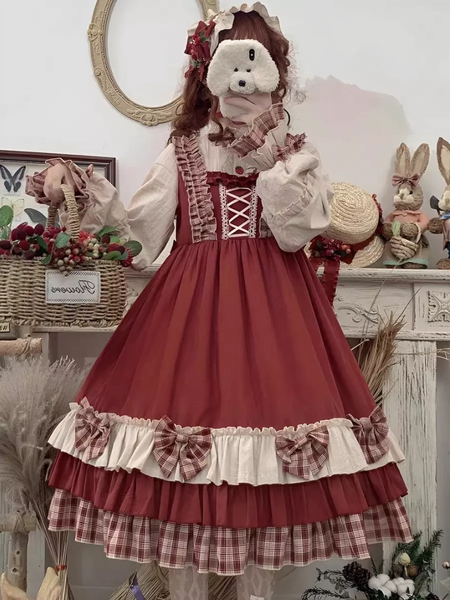 Red sweet Lolita jumper skirt without apron displaying bow decorations on trim and adjustable lace-up front closure