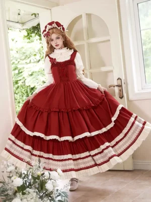 Red sweet lolita jumper dress with white lace trim and tiered ruffled skirt front view