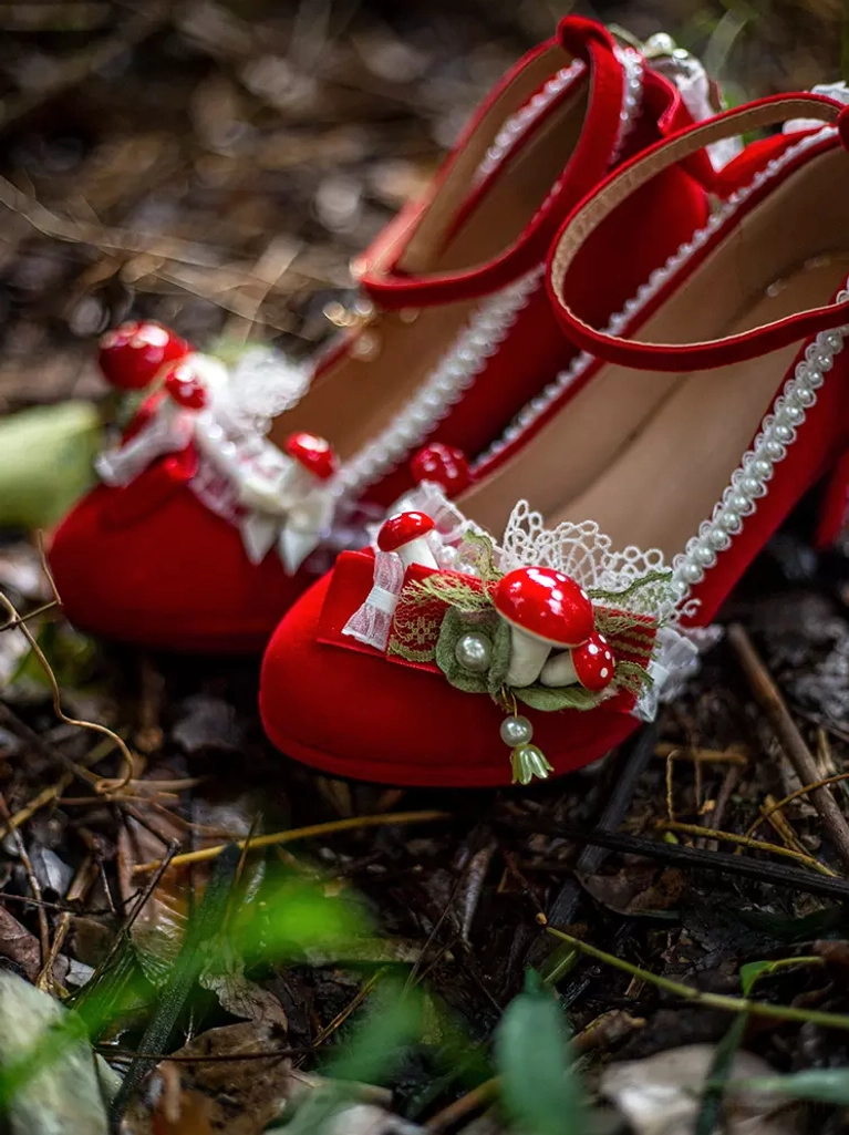 pair red lolita platform shoes top side view outdoor soil ground pearl chain trim mushroom appliques lace frills chunky heel