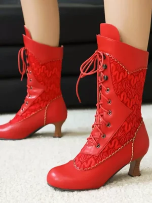 Red vintage mid-calf lolita boots with lace panel overlays and round toe, side three-quarter view showcasing lace-up design and low wooden heel