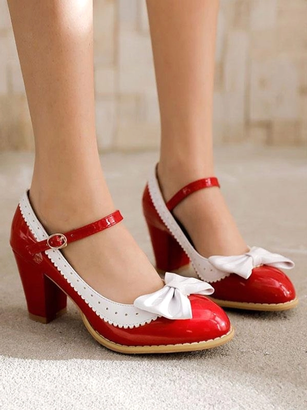 Red and white mary jane lolita pumps worn on-foot front view indoor carpet floor female model legs with white bow decoration and red ankle strap