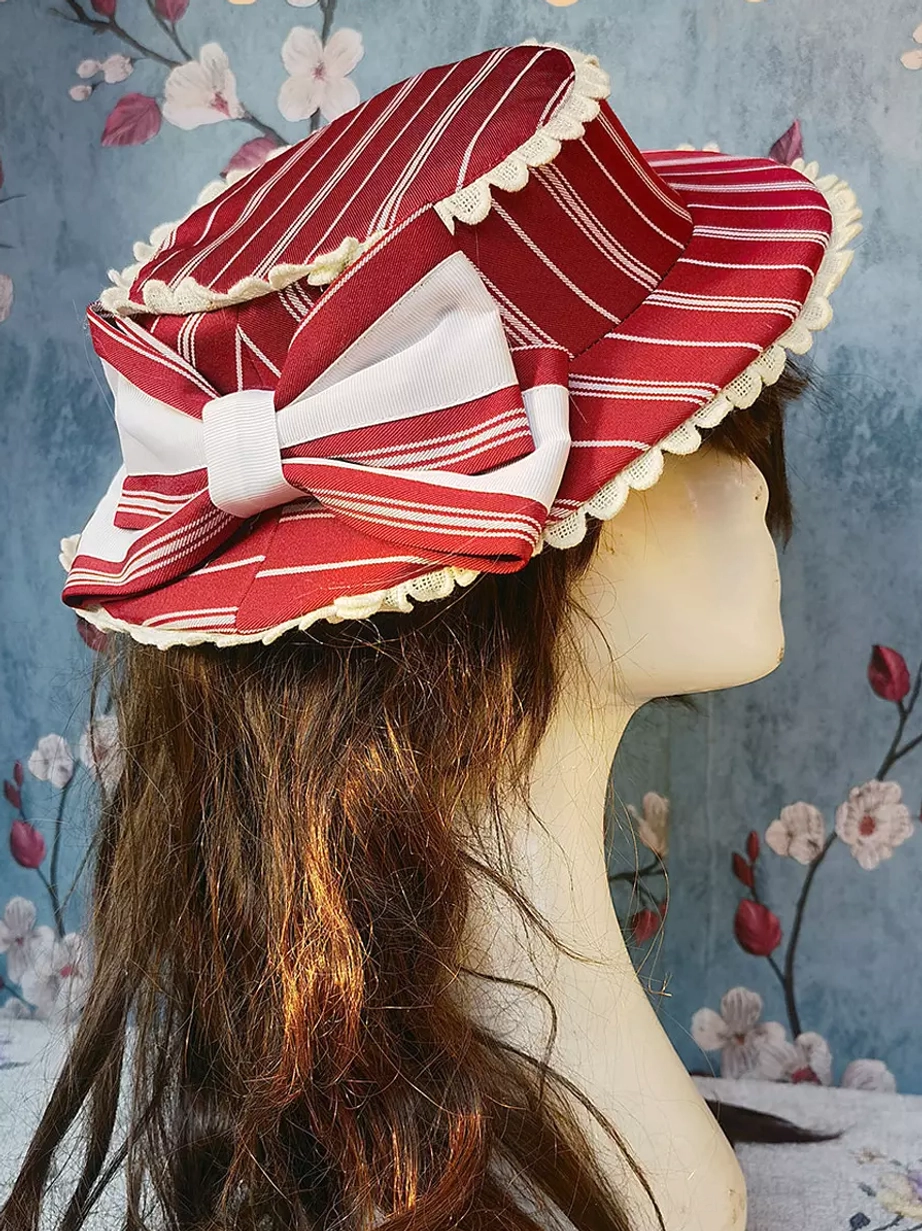Red and white striped rococo lolita hat with coordinating bow, traditional lolita headdress with lace edge detail