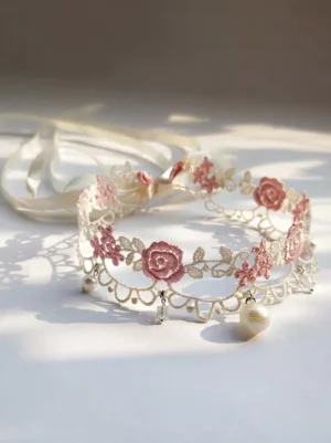 Ivory Rococo lace choker with pink rose embroidery and hanging pearl crystal pendants overhead view detail