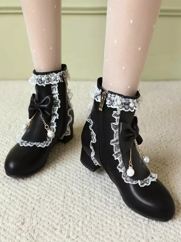 Rococo lolita boots detail view of premium PU leather upper material, decorative bows and multi-layered lace ruffle trim work for sweet lolita aesthetic