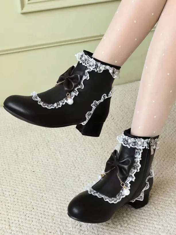 Rococo style lolita ankle boots close-up showing side zipper fastening mechanism, pearl pendant swing ornaments and delicate ruffle lace embellishments