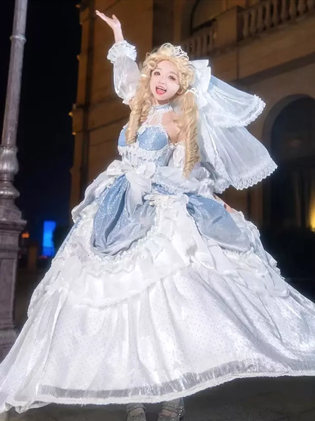 Blue and white floral Rococo Lolita gown showcasing dramatic back bow, tiered ruffled train, and elegant silhouette detail