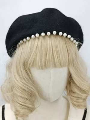 Black pearl-trimmed Rococo Lolita beret front view on blonde curly wig mannequin, fuzzy felt texture with white pearl brim trim sweet Lolita headdress
