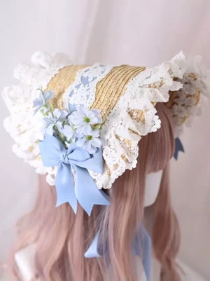 Rococo lolita tea party bonnet rear view showing white ruffled lace construction, sky blue satin bow detail, and delicate blue flower accents