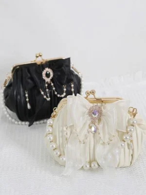 Rococo kiss-lock lolita bag dual color options black and ivory off-white with pearl and rhinestone bow embellishments top-down view