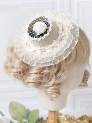 Ecru cream rococo lolita mini top hat with white silk rose and ruffled lace veil back view on mannequin head