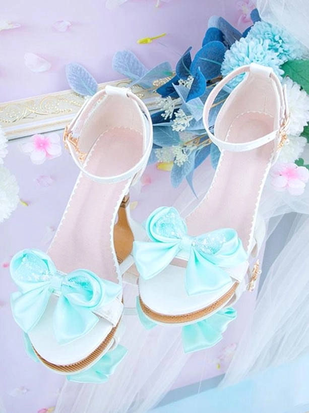 Rococo lolita pointed toe sandals white leather mint blue bow scalloped edge close-up overhead floral props