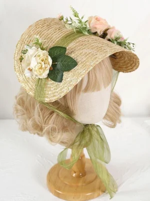 Rococo pastoral straw bonnet lolita hat with artificial flowers and green chiffon ribbon front three-quarter view on mannequin
