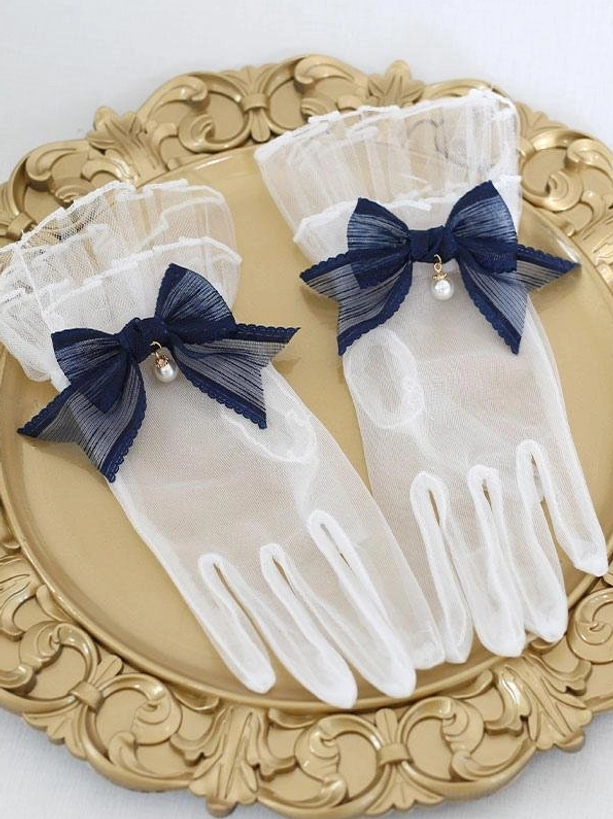Navy blue pearl bow sheer mesh lolita gloves with ruffled cuffs displayed on ornate gold tray flat lay