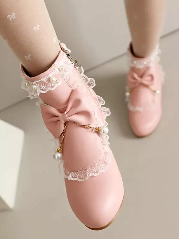 Side overhead view of pink rococo lolita boots showing low block heel, functional side zipper closure and delicate ruffle lace detail work on ankle shaft