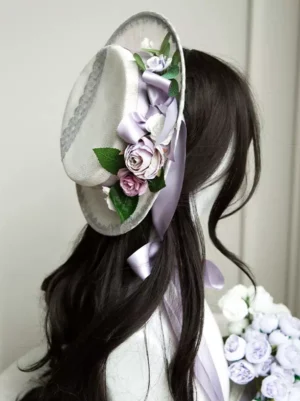 Rococo Sweet Lolita boater hat back view close-up featuring purple and blush roses with green foliage, off-white base with elegant purple satin ribbon bow - perfect vintage Lolita headdress for tea party and garden occasions