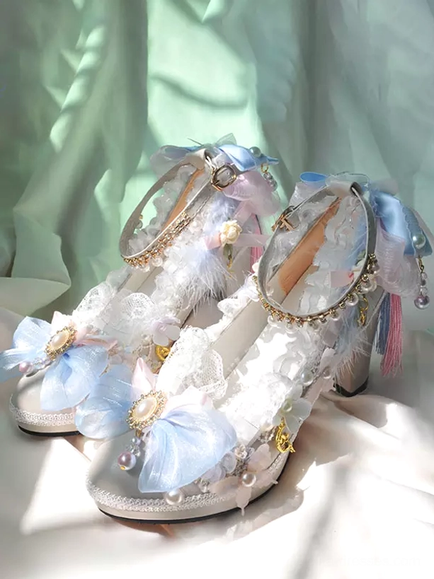 Rococo sweet lolita pumps front three-quarter view featuring white PU leather upper with blue organza bows, pearl embellishments, ruffled lace trim, chunky block heel platform