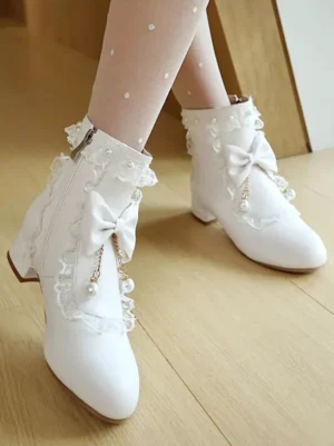 Side oblique view of white rococo lolita boots displaying side zipper closure, low block heel, lace trim details and ruffle adorned ankle collar with pearl accents