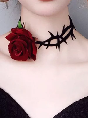 Gothic rose thorn choker worn on model neck close-up, featuring wine-red flocked rose with black velvet thorn band
