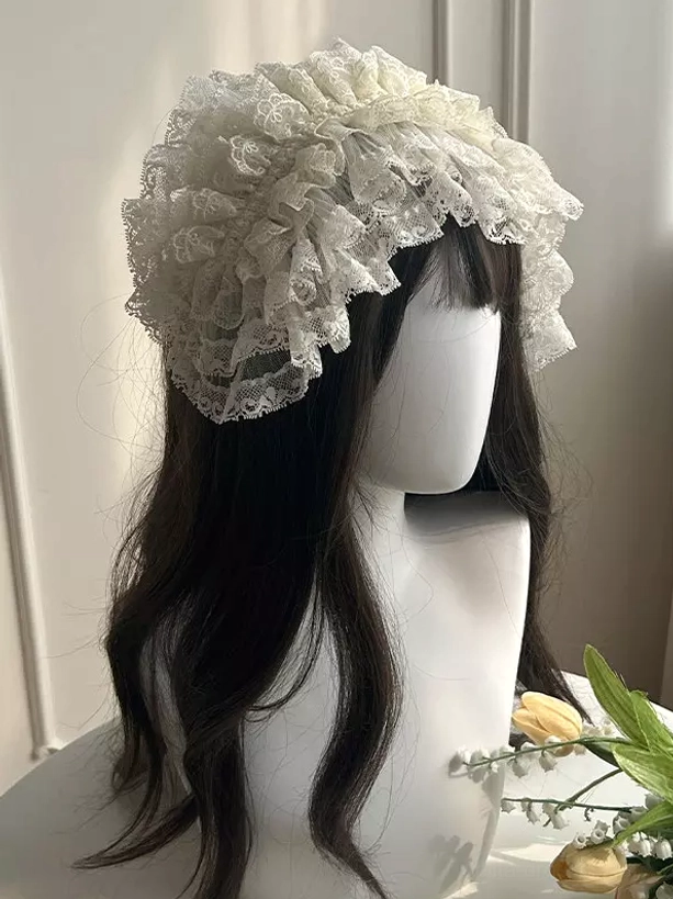 Ruffled lace hair bonnet mannequin head close-up all-over lace ruffle design ivory off-white color accessory