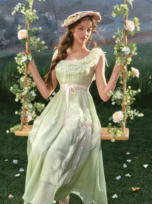 Sage green sweet lolita midi dress with square neck lace ruffle and pink waist bow worn outdoors on flower swing