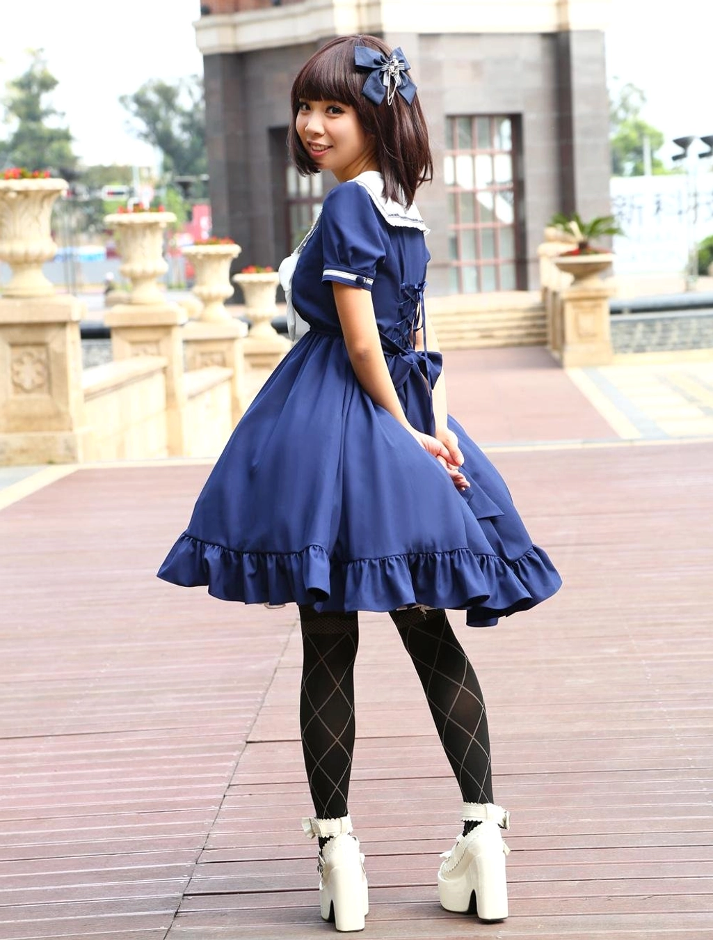 Sailor-inspired lolita one-piece dress skirt volume and hem ruffle detail, bell-shaped silhouette