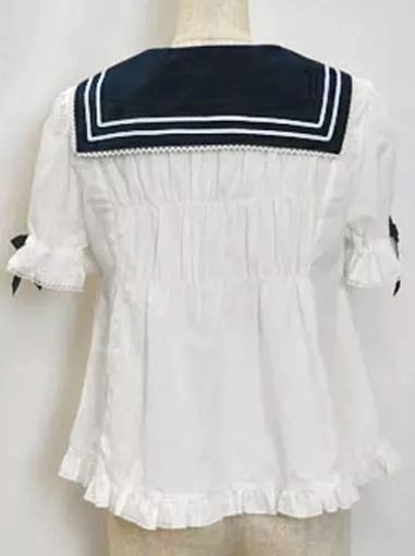 Sailor collar short sleeve blouse back view showing shirred back design ruffled hem and black sailor collar with white stripe trim